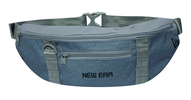 Sacoche banane New Era, coloris gris, c’est l’exemple parfait de l’accessoire streetwear stylé et pratique à la fois avec ses compartiments zippés, 40 € - Moderny’s Sport